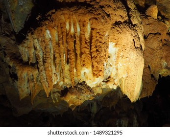 Rock Formations At Black Chasm Cavern In Northern California. Stalactites, Stalagmites And Columns Are Illuminated By The Park Lighting System.