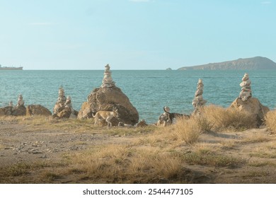 Rock formations on the beach at sunset, place to meditate and rest on the beach, Love - Powered by Shutterstock