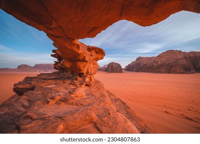 Rock formations in the red desert of Wadi Rum in Jordan - captured in the golden hour - Shutterstock ID 2304807863