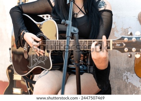 Rock guitarist woman rehearsing on rooftop