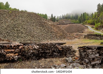 Rock heaps and logs at an old cobalt mine in Åmot, Norway