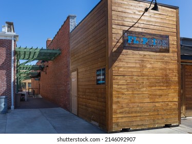 ROCK HILL, SC, USA-10 APRIL 2022: The Flipside Restaurant building exterior, with signs and alleyway entrance.