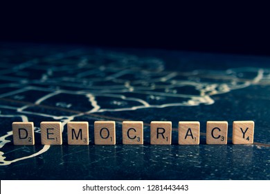 Rock Hill, SC/USA - 1/11/2019: Democracy Spelled With Scrabble Tiles On Map Of United States