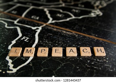 Rock Hill, SC/USA - 1/11/2019: Impeach Spelled With Scrabble Tiles On Map Of United States