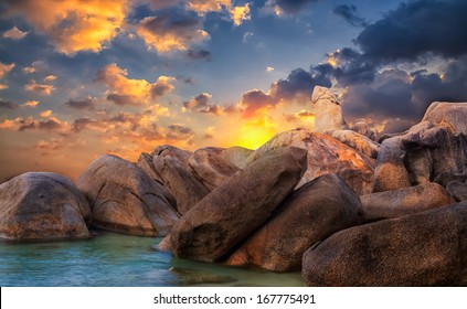 The Rock Hin ta from Thai island of Koh Samui. The picturesque pile of rocks on the beach, illuminated by the sunrise