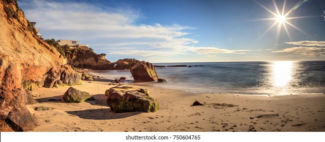 Rock Keyhole and a long exposure of smooth water at Pearl Street Beach in Laguna Beach, California