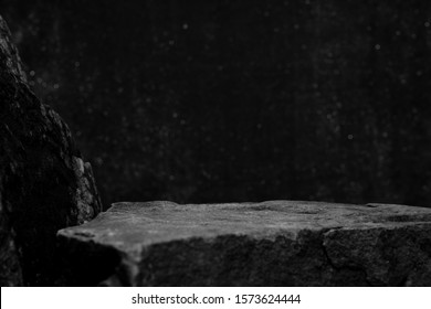 A Rock Mineral Product Display Shelf, Showing a Rough Texture to the Platform with a Bokeh Background