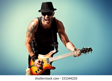 Rock Musician Is Playing Electrical Guitar.