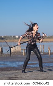 Rock Musician Woman Singing Near Water Outside