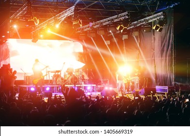 rock musicians and fans during the performance. Web banner.