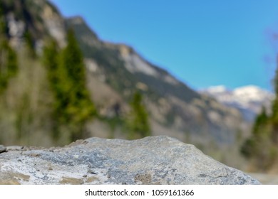 Rock with natural unfocused mountains background - Shutterstock ID 1059161366