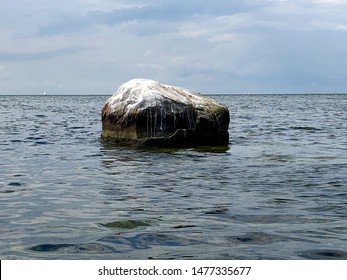Rock in Oresund sound between Denmark and Sweden. The rock has marks from different sea levels, and is generously covered by bird droppings.