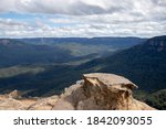 rock outcropping overlooking blue mountains