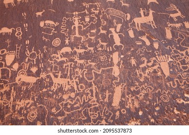Rock panel covered with one of the largest known collections of ancient petroglyphs at Newspaper Rock Historical  Monument in Utah
