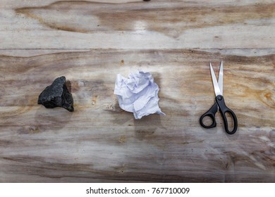 Rock  Paper Scissors    Actual objects symbolizing the game vintage wooden background