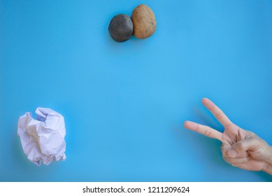 Rock Paper Scissors On Blue Background, Top View, Copy-space.