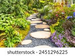 rock path leading through a flower garden