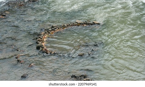 Rock Pool In The Middle Of The River As A Fish Trap