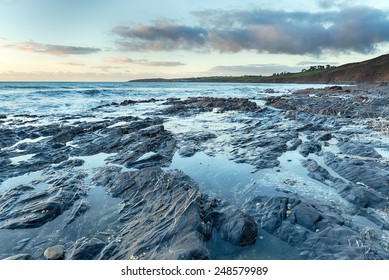 Rock Pools At Low Tide On Pendower Beach In Cornwall