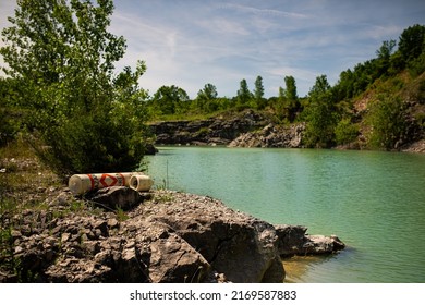 Rock Quarry Water View With Hazard Dingy In Foreground