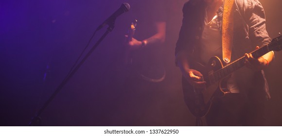 Rock And Roll Music Panoramic Background Photo, Guitar Players On A Stage, Soft Selective Focus