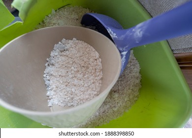 Rock Salt In A Bucket Is Ready To Scoop And Melt Ice On Your Wintery Sidewalk