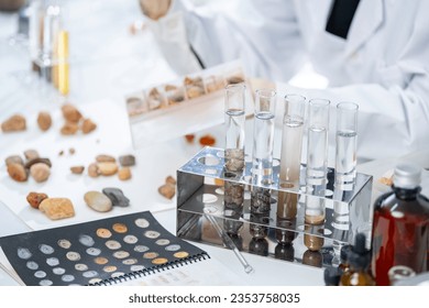 Rock sample in geology science laboratory research, mineral soil test in chemistry lab industry analysis work, geological stone material from nature with scientific equipment for industrial business