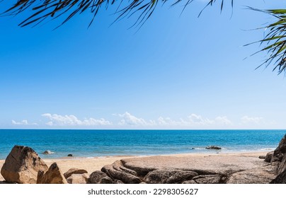 Rock, Sand Stone beach seaside with green leaves and blue sea Sky summer landscape daylight background well Space rock stand, Podium for montage Display product Backgrounds  - Powered by Shutterstock