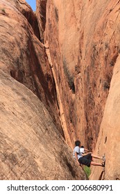 Rock Scrambling In Glen Canyon National Recreation Area -that Stretches From The Beginning Of The Grand Canyon At Lees Ferry In Arizona To The Orange Cliffs Of Southern Utah