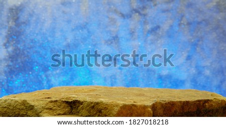A Rock Shelf, Showing the Top Middle Ledge with a Grit Texture to the Stone, with a Variation of a Blue Orbs Background.