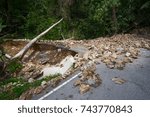 Rock slide collapse after a mudflow on a mountain road in a rural area