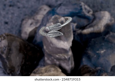 Rock Solid Commitment: Elegant rings gracefully positioned on rough, unyielding stones, epitomizing the unbreakable bond of love and trust.