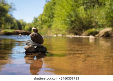 Rock stacking in colorado river USA, Arizona, Yavapai County, Sedona, Cathedral Rock - Powered by Shutterstock