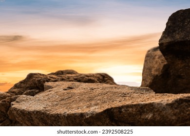 Rock Stone Podium on sunset Sky Background, Rock podium outdoor with orange sunlight sky well space for Display Product banner background 