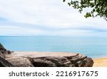 Rock, Stone Stage in nature with Sea sand Beach seashore Landscape and blue sky nature Background well editing montage Displays product tourism 