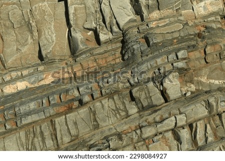 Rock strata detail: layers of carboniferous sandstone with interbeds of shale photographed at Welcombe Mouth, North Devon