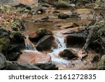Rock strewn stream bed in winter