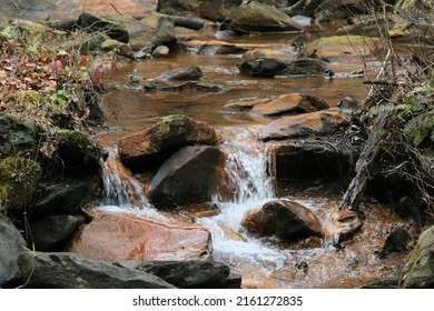 Rock Strewn Stream Bed In Winter