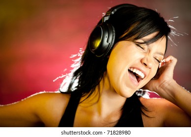 Rock Style Woman With Headphones Listening To Music 		