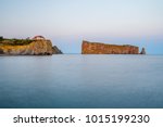 Percé Rock with sunset light as viewed from the town of Percé (Canada, Québec)
