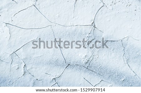Rock surface with cracks. Painted Abstract Wall. Cracked ice. White Background. Abstract texture. Rock texture. Stone background. Stone mineral texture. Rock pile background. Rough structure.