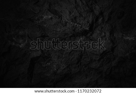 Rock texture. Dark black wall. Stone background