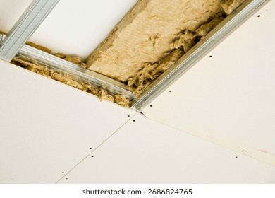 ROCK WOOL INSULATION AND DRYWALL CEILING INSTALLATION - Mineral wool panels and gypsum boards used in construction, renovation, energy efficiency, acoustic insulation and home improvement