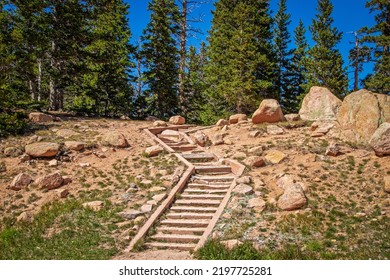 Rock Zig Zag Steps Up Rocky Hillside With Pine Trees Against Blue Sky At Top-destination