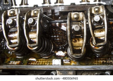 Rocker Arms Of High Mileage Engine Showing Sludge Buildup