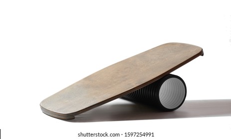 Rocker-roller board. Isolated oval wooden deck for balance board. solid plastic roller for balance board. Rocker-roller boards. oval wooden deck for balance board with tube