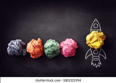Rocket chalk drawing paper ball on blackboard blast off for successful business startup idea