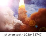 Rocket and clouds. The elements of this image furnished by NASA.