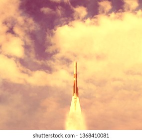 Rocket and clouds. Taking off from ground, lift off. The elements of this image furnished by NASA.