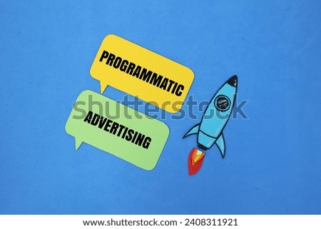 rocket and colored paper with the word Programmatic Advertising